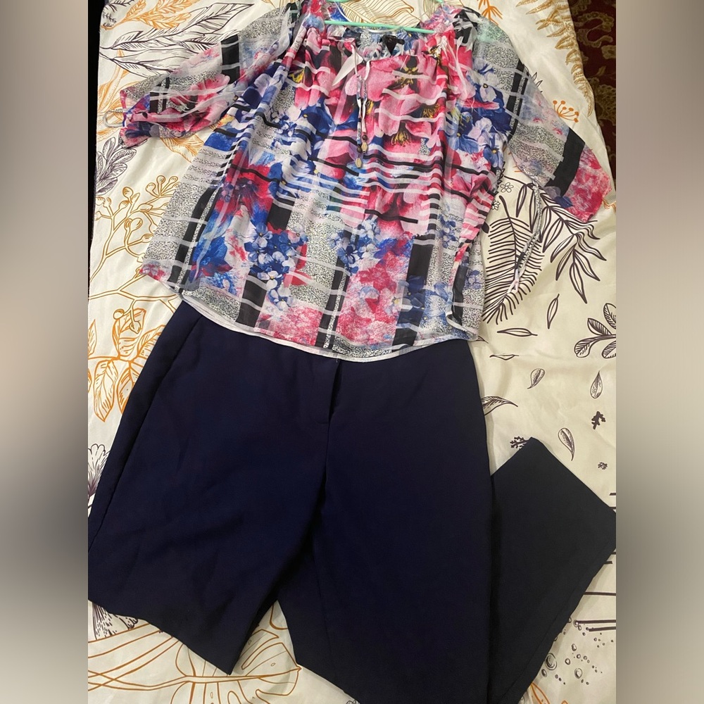 Two piece outfit including Investments dress pants and Style and Co top